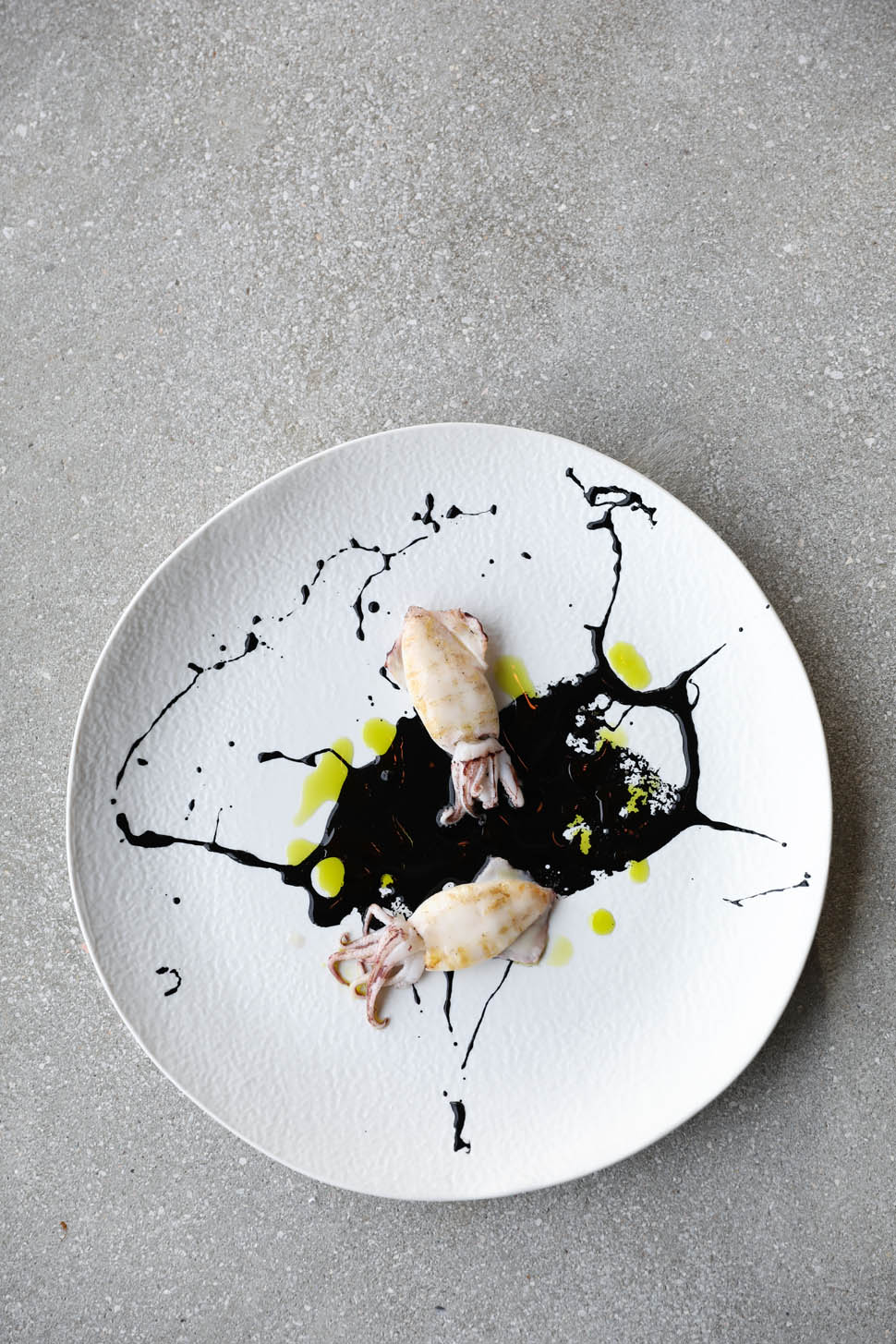 2 Pan seared squid with sepia ink spicy sauce and extra virgin olive oil