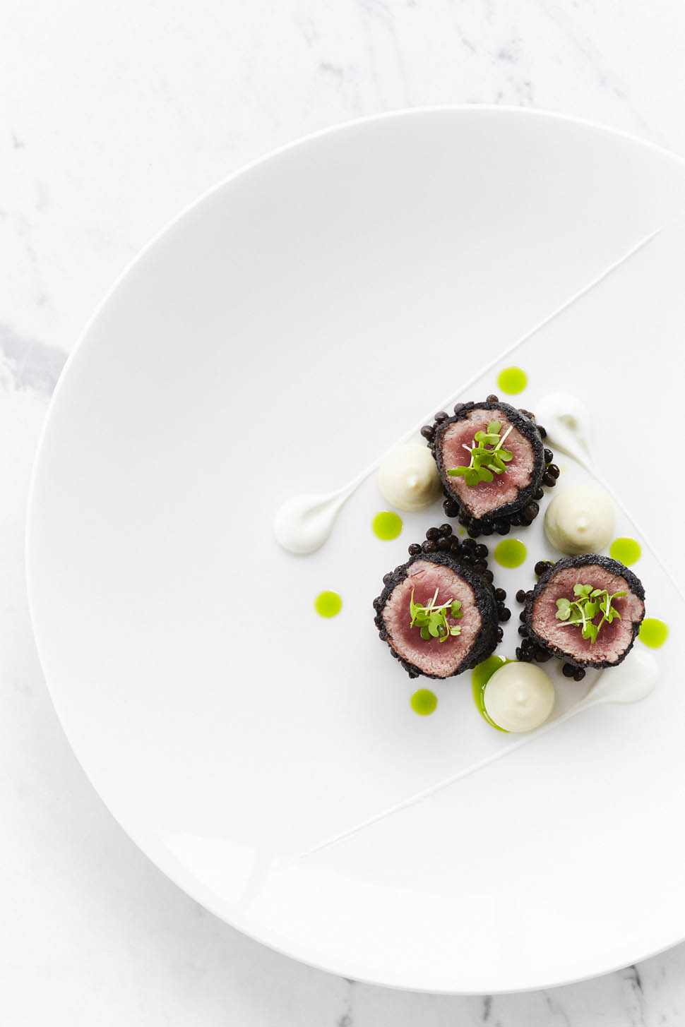 6 Black olive crusted lamb loin with charred eggplant puree homemade yogurt and dill oil