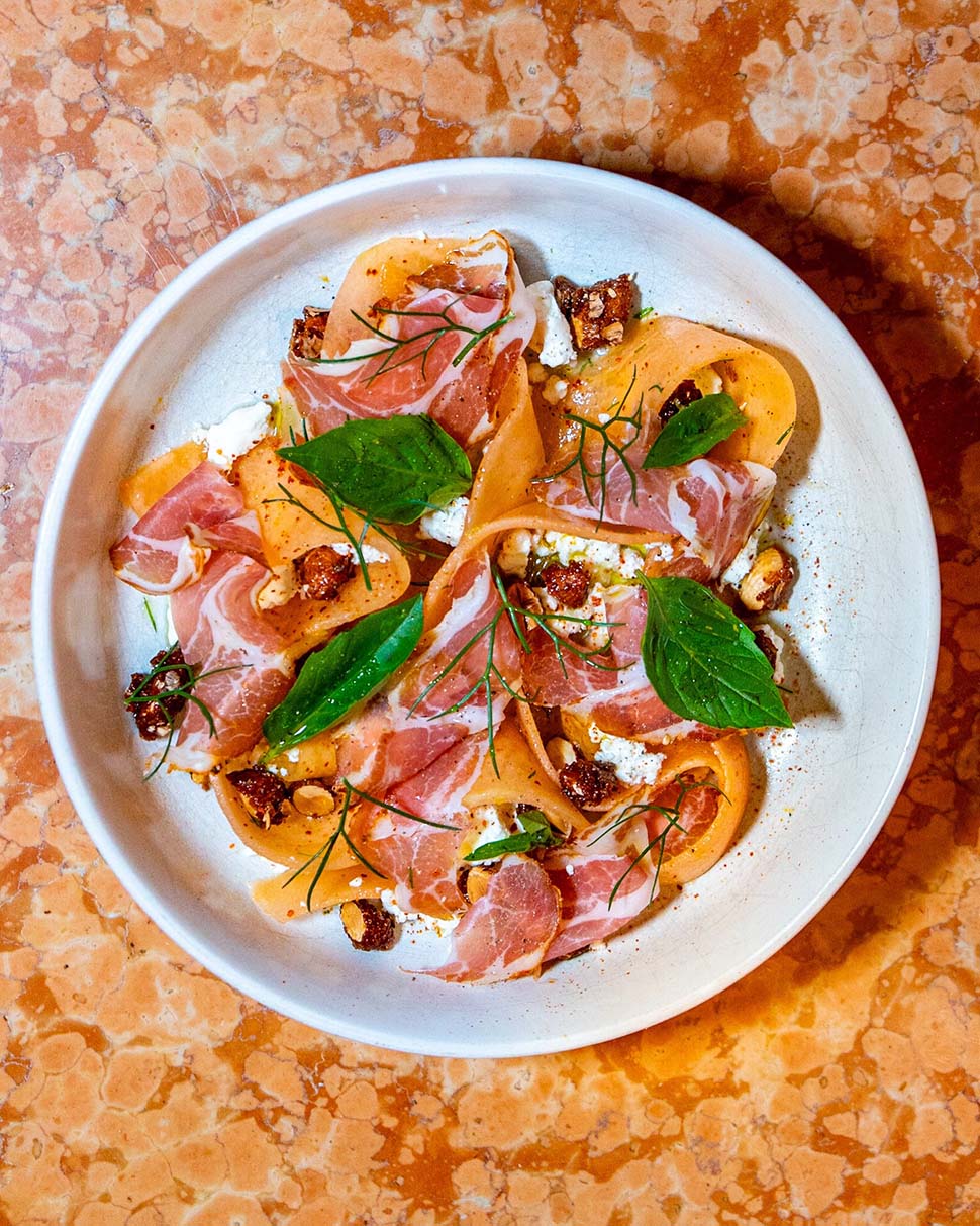 Spicy Cantaloupe Coppa with candied almonds sheeps cheese and Thai basil Don Angie PS