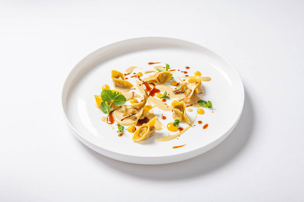 Tortello ripieno di cosce di anatra carciofi arancia e cynar
